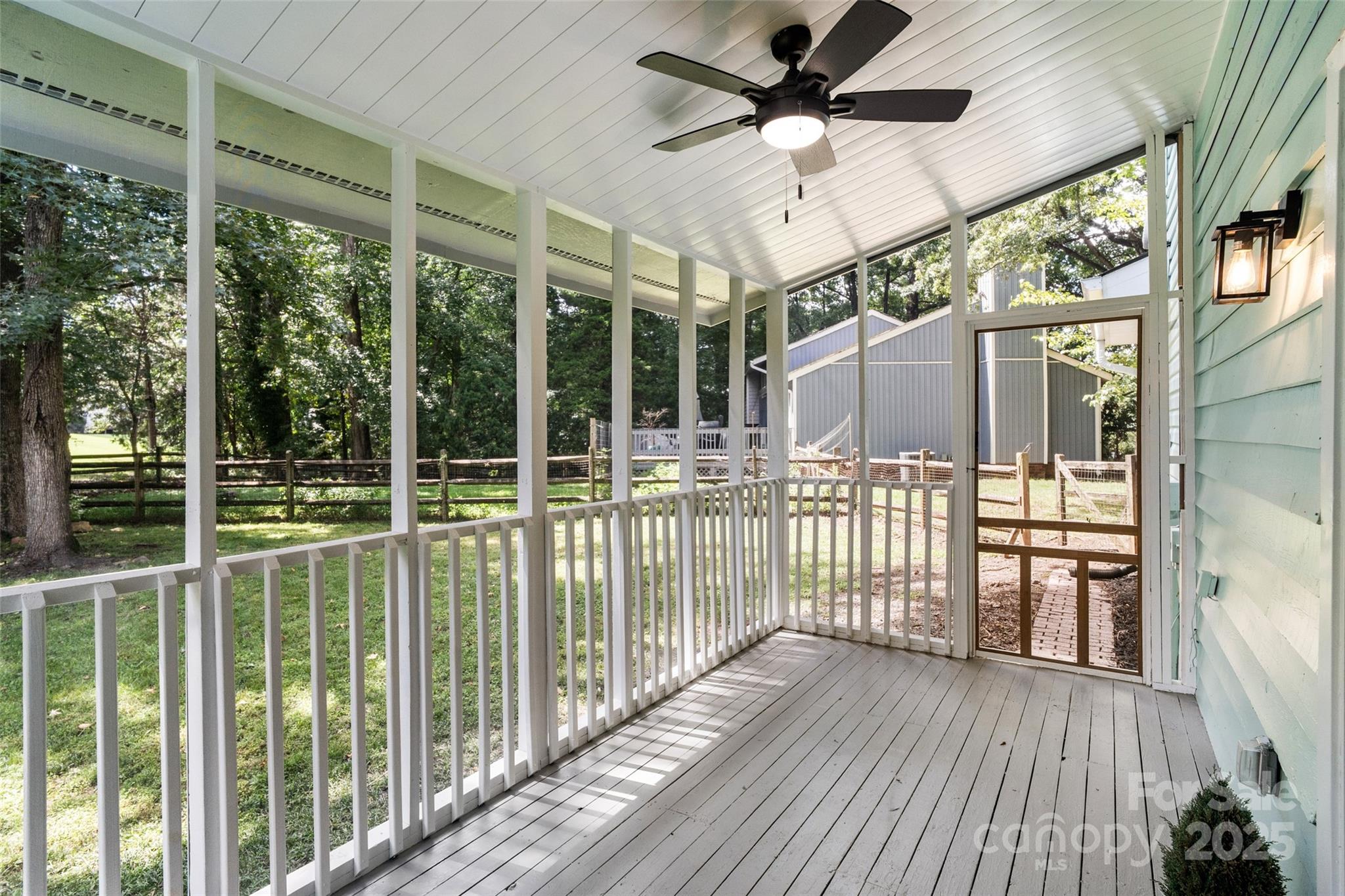 9514 Fairway Ridge Road Charlotte, NC 28277 - Photo 29 of 36 a view of a porch with wooden floor and iron stairs