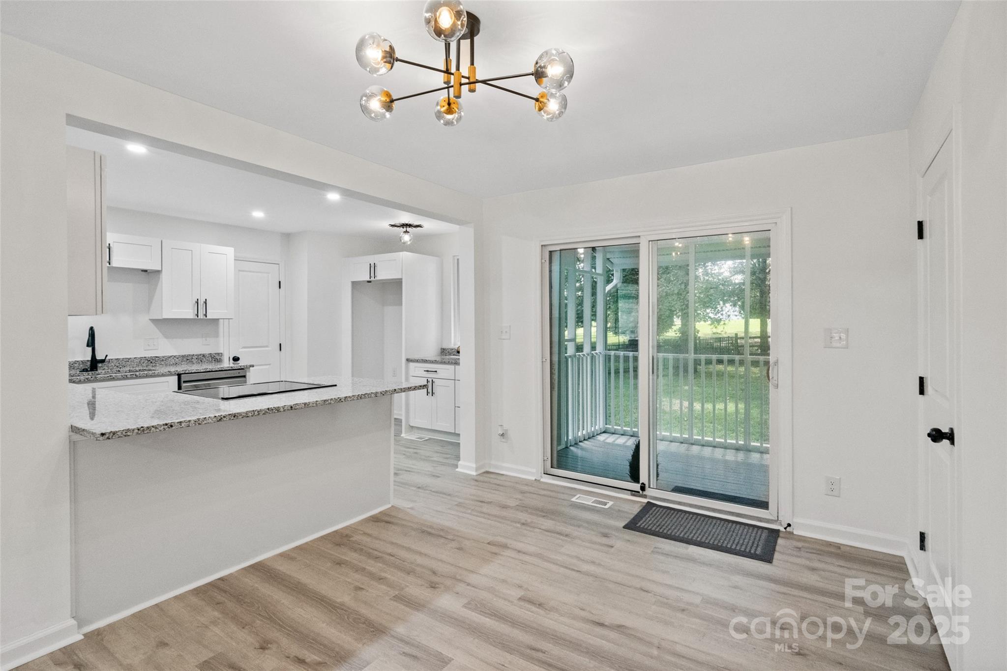 9514 Fairway Ridge Road Charlotte, NC 28277 - Photo 10 of 36 a view of kitchen with stainless steel appliances granite countertop cabinets and wooden floor