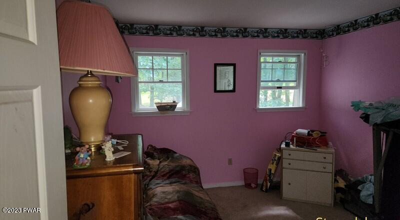 249 Pin Oak Road Stroudsburg, PA 18360 - Photo 28 of 34 a room with furniture and a window