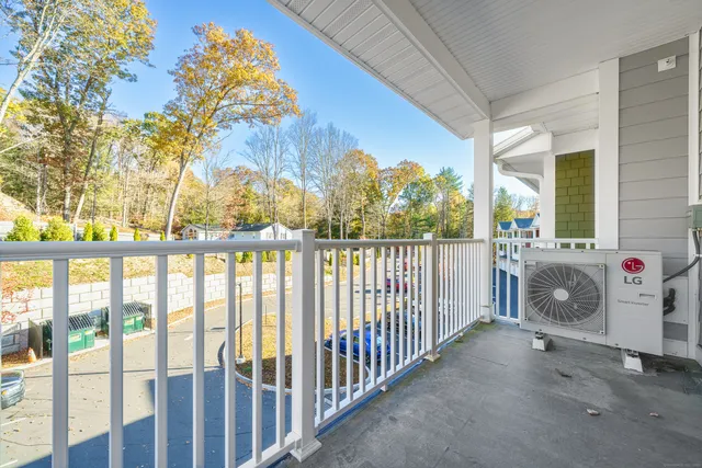 a view of balcony with furniture and garden