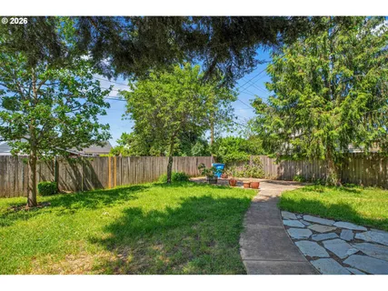 a backyard of a house with lots of green space