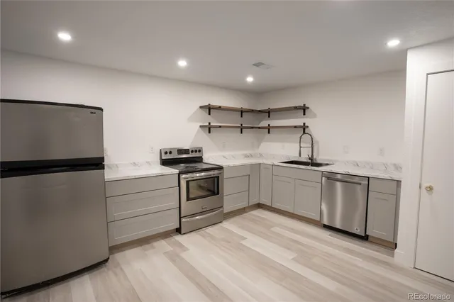 a kitchen with a white cabinets and white appliances