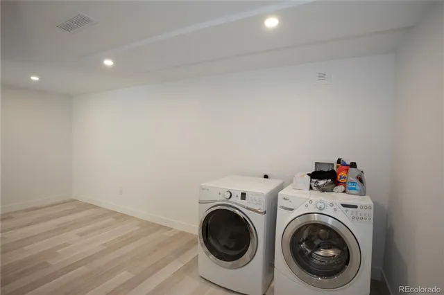 a view of storage and utility room with washer and dryer
