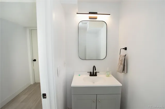 a bathroom with a sink and mirror