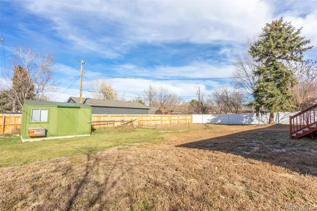 a view of a big yard with a house