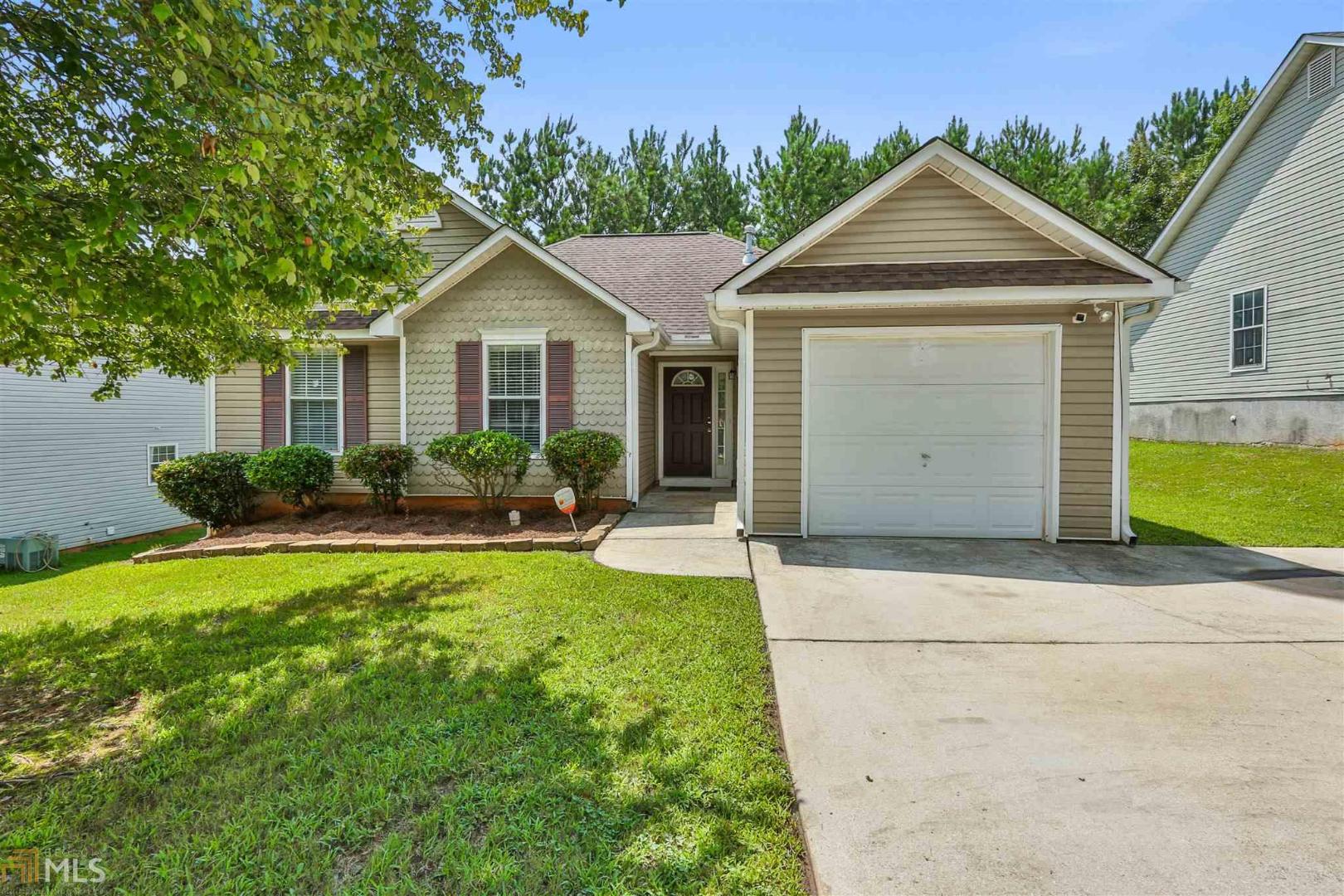142 Misty Ridge Trail Stockbridge, GA 30281 - Photo 1 of 1 a front view of house with yard and green space