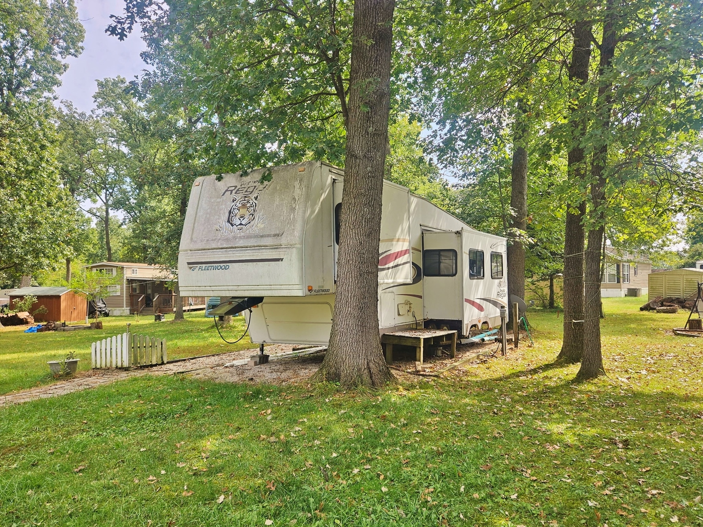 7-197 Woodhaven Lakes Sublette, IL 61367 - Photo 2 of 11 a view of a house with backyard and a tree