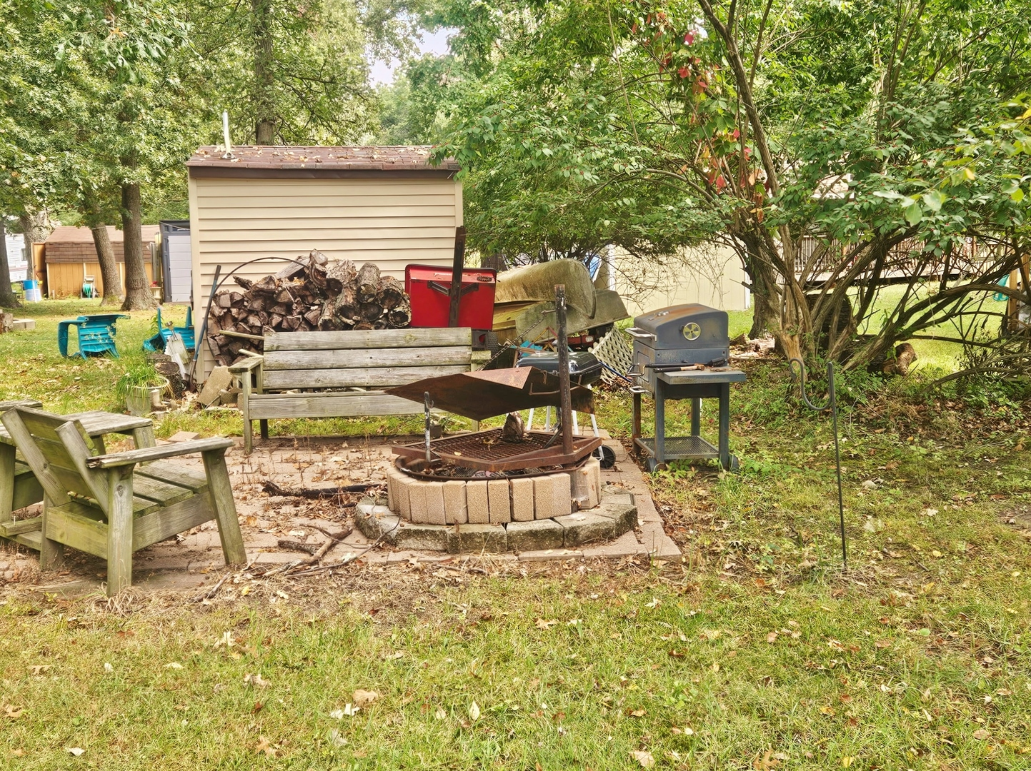 7-197 Woodhaven Lakes Sublette, IL 61367 - Photo 10 of 11 a view of a chairs and tables in the back yard of the house