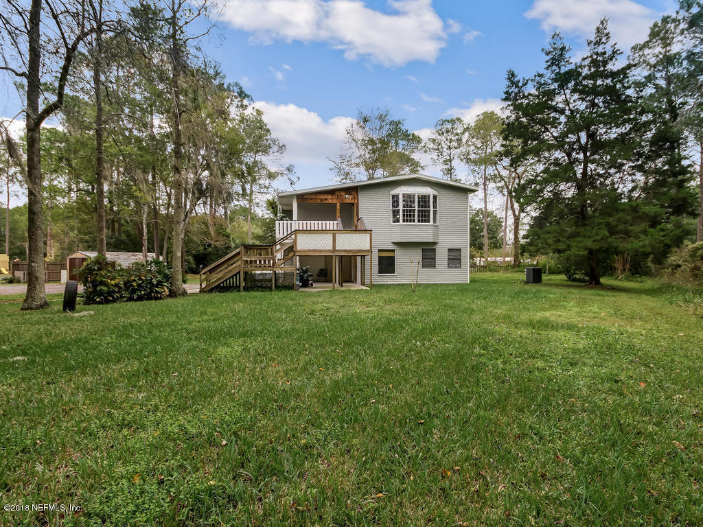 54029 Lawhon Road South Callahan, FL 32011 - Photo 60 of 69 a front view of a house with a yard