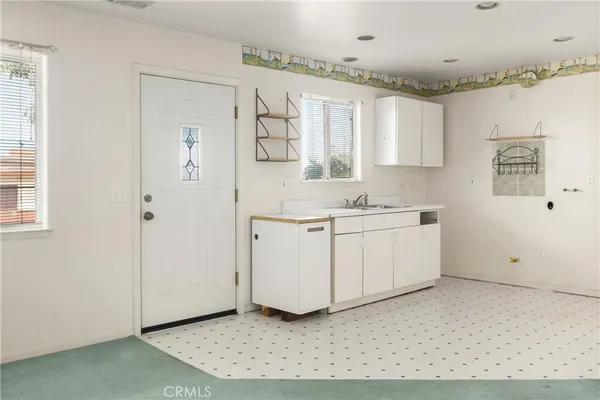 a view of cabinets with wooden floor