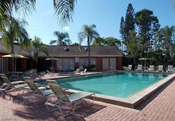 a view of a house with swimming pool patio