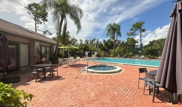 a view of a swimming pool with a patio