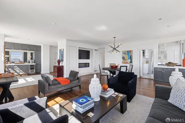 a view of a hallway with wooden floor and stairs
