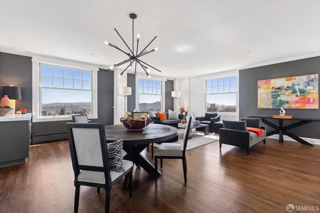a view of a dining room with furniture and wooden floor