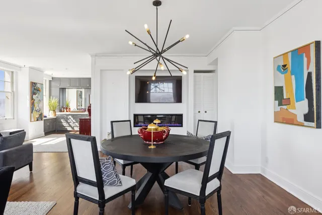 a view of a dining room with furniture and wooden floor