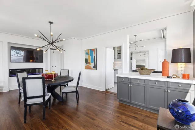 a living room with furniture window and wooden floor