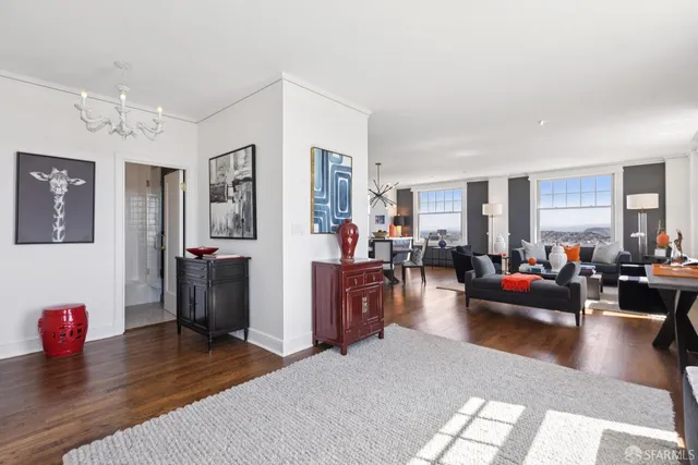 a living room with furniture or couch and a wooden floor
