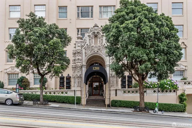 a view of a swimming pool with a table and chairs