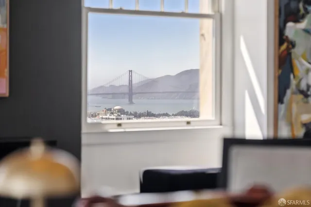 a view of a kitchen with a sink and a window