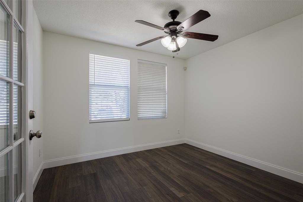 3901 Kathryn Way McKinney, TX 75070 - Photo 14 of 26 a view of wooden floor and a chandelier fan in a room