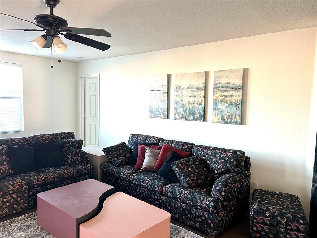 3901 Kathryn Way McKinney, TX 75070 - Photo 6 of 26 a living room with furniture and a window