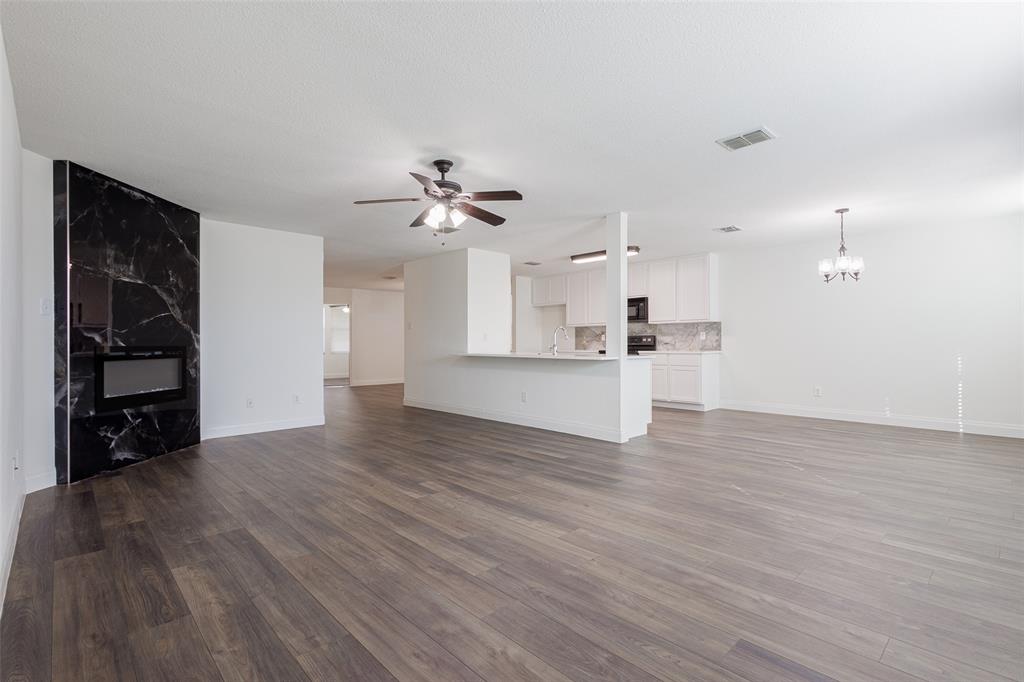 3901 Kathryn Way McKinney, TX 75070 - Photo 9 of 26 a view of empty room with wooden floor