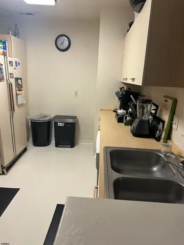 a room with a couch and a stove top oven