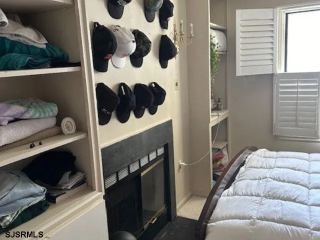 a bedroom with a bed and a lamp