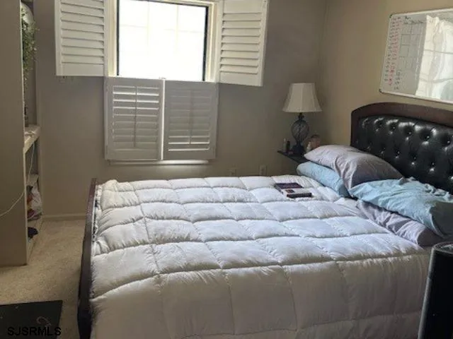 a bathroom with a toilet a sink and a mirror