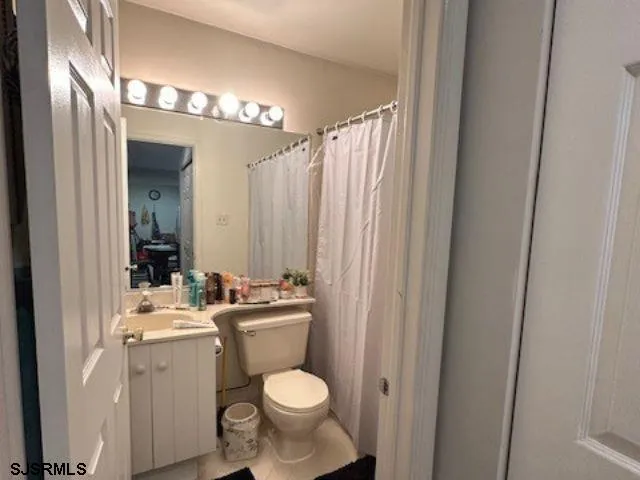 a bathroom with a toilet and a sink