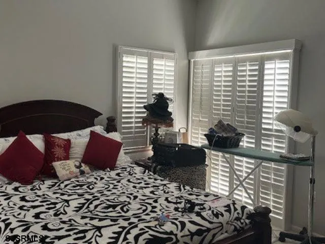 a front view of a house with a yard and green space