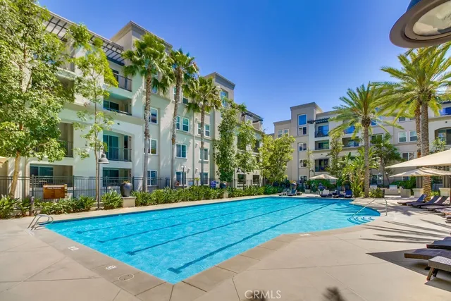 a view of a tall building with a yard