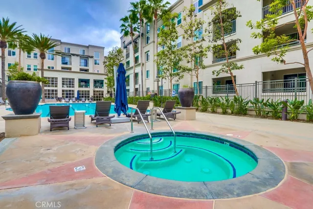 a swimming pool with outdoor seating yard and barbeque oven