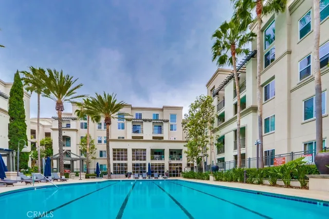 a view of a building with a garden and plants