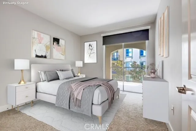 a spacious bedroom with a bed and a large window