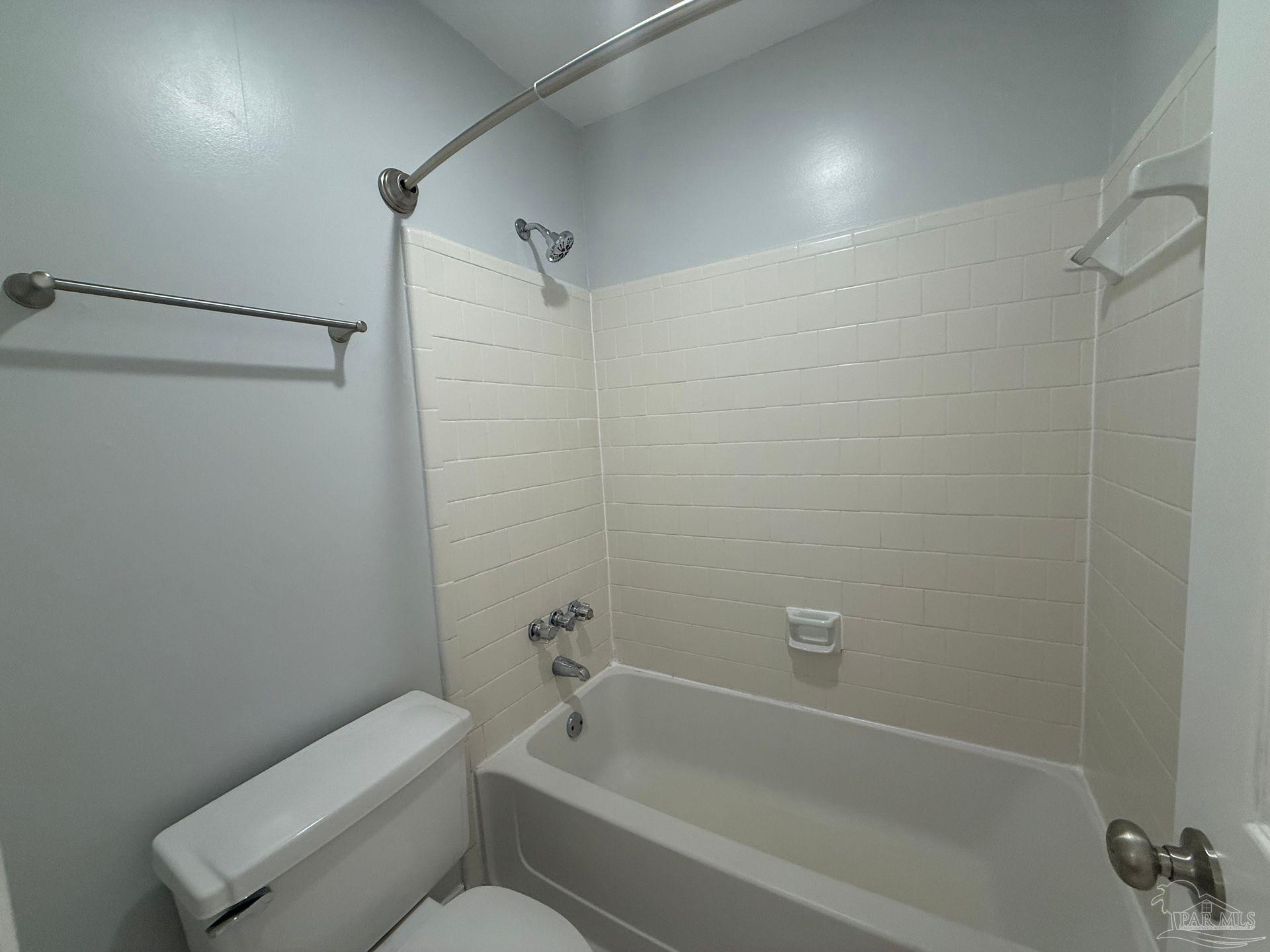 2715 Summertree Lane Gulf Breeze, FL 32563 - Photo 12 of 25 a bathroom with a toilet and a bathtub
