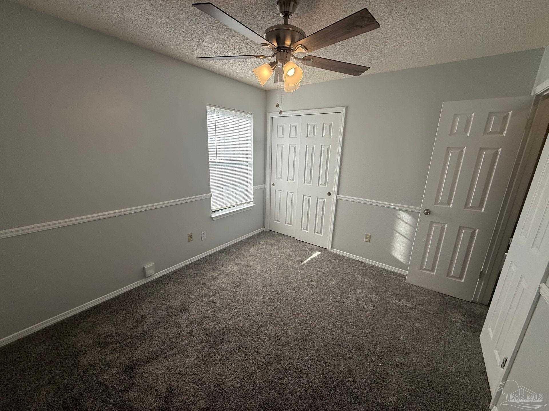 2715 Summertree Lane Gulf Breeze, FL 32563 - Photo 16 of 25 a view of an empty room with a window