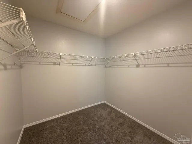 a view of a room with racks on the wall