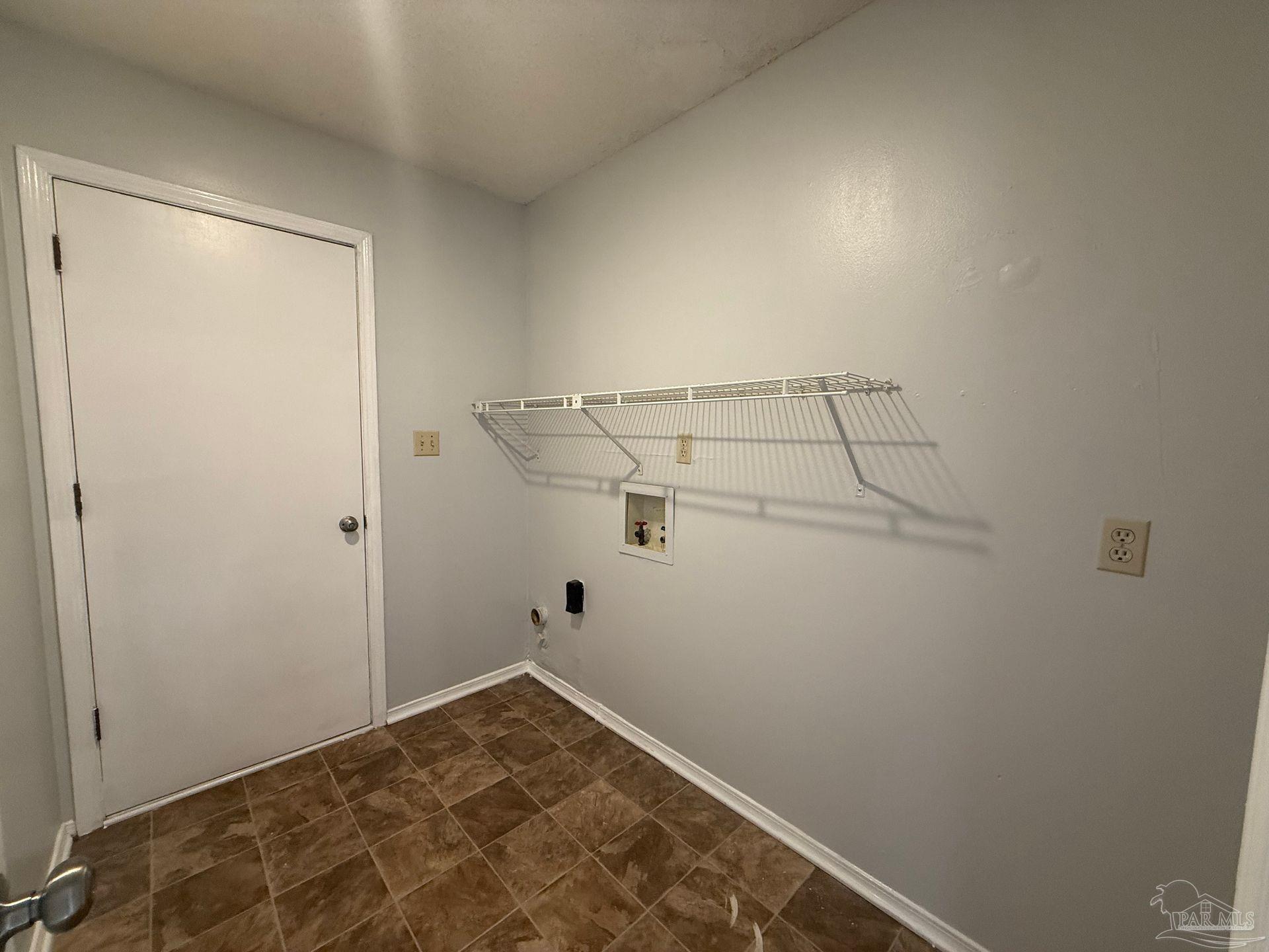 2715 Summertree Lane Gulf Breeze, FL 32563 - Photo 23 of 25 a view of a room with racks on the wall
