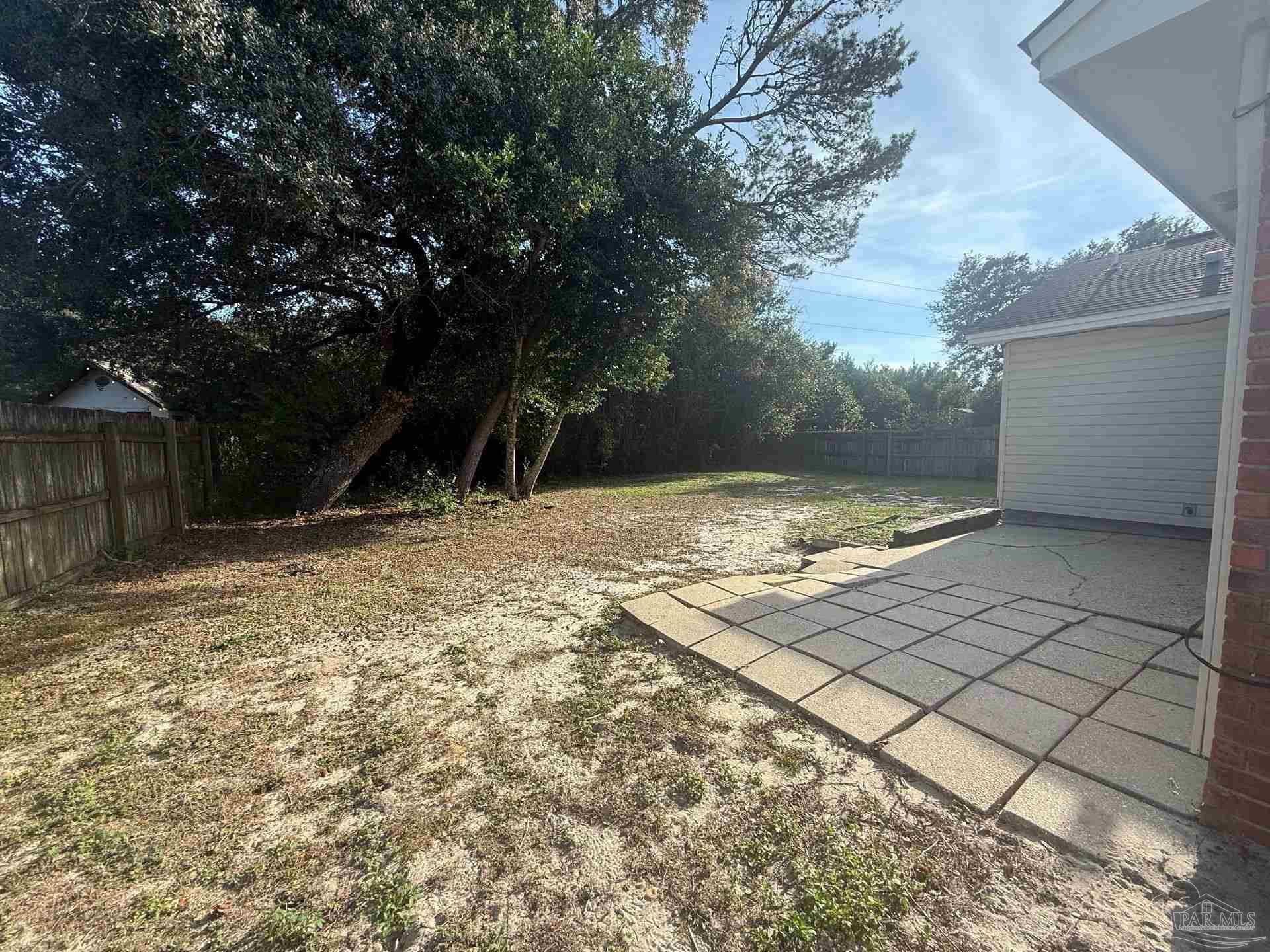 2715 Summertree Lane Gulf Breeze, FL 32563 - Photo 24 of 25 a view of a backyard of the house