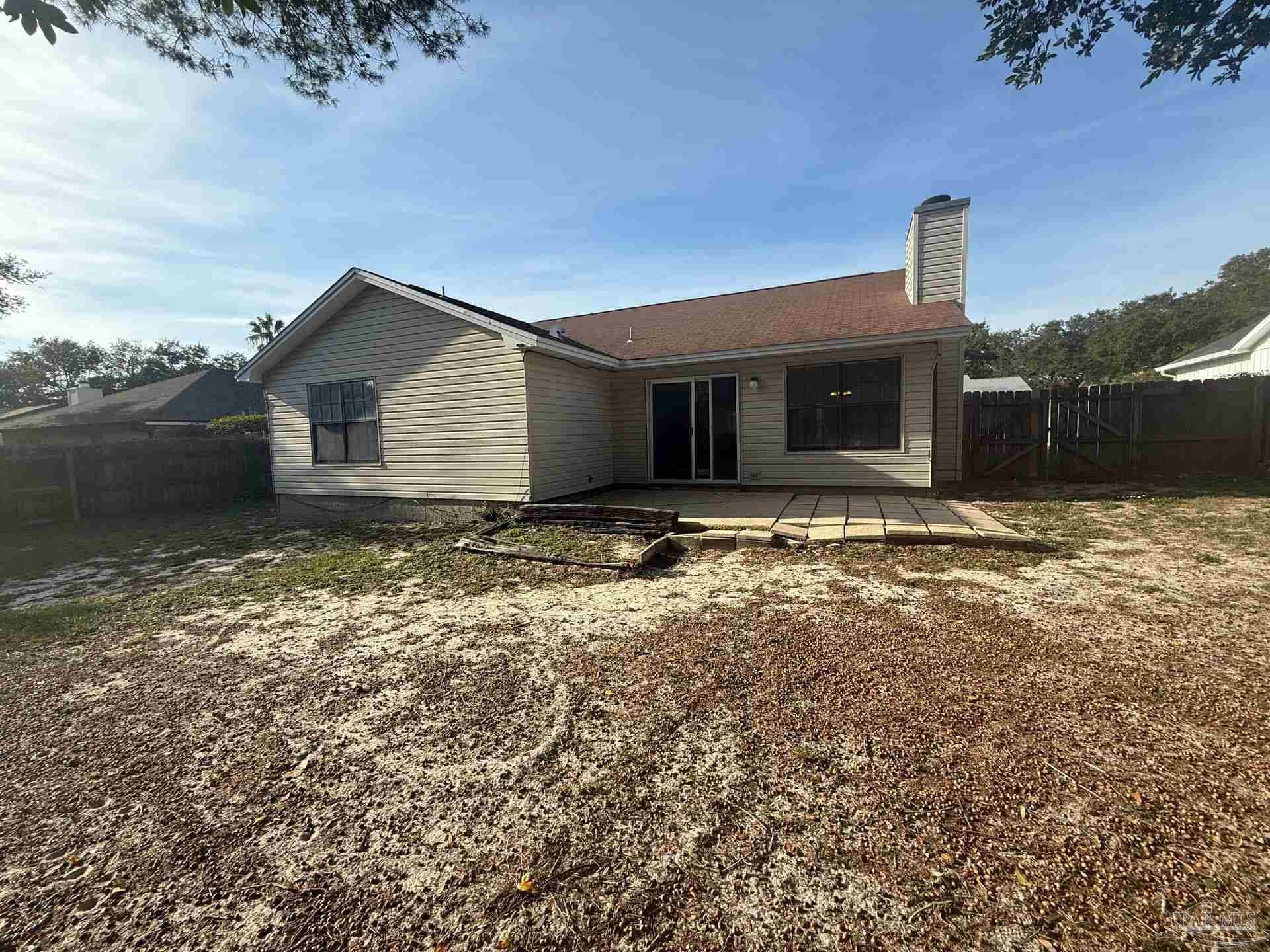 2715 Summertree Lane Gulf Breeze, FL 32563 - Photo 25 of 25 a view of a house with a yard