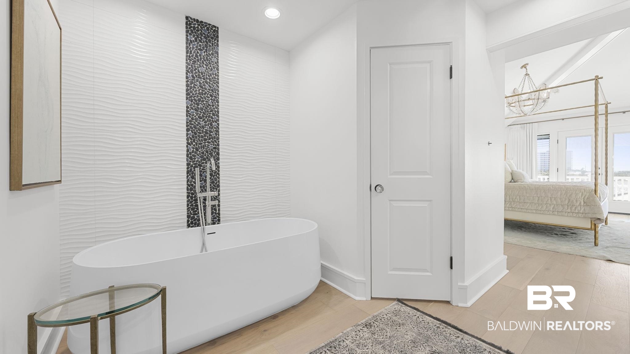 30194 River Road Orange Beach, AL 36561 - Photo 14 of 45 Bathroom with connected bathroom, a soaking tub, light wood-style floors, and hanging lights