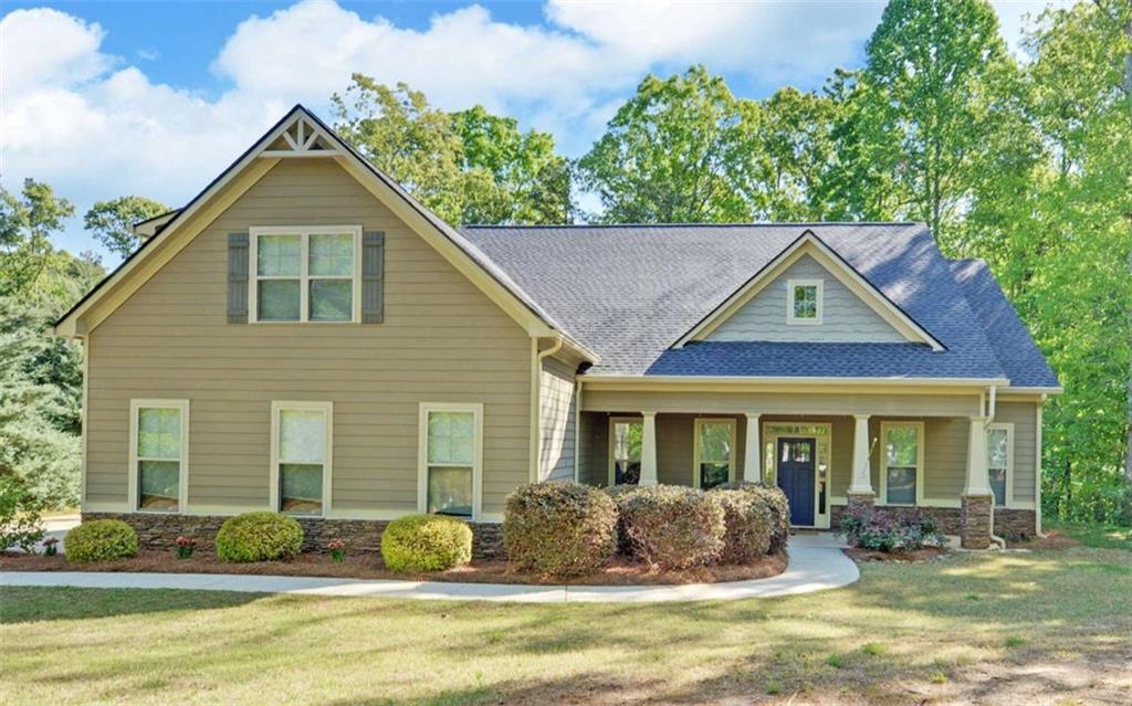 255 Abbington Way Clarkesville, GA 30523 - Photo 1 of 49 a front view of a house with garden