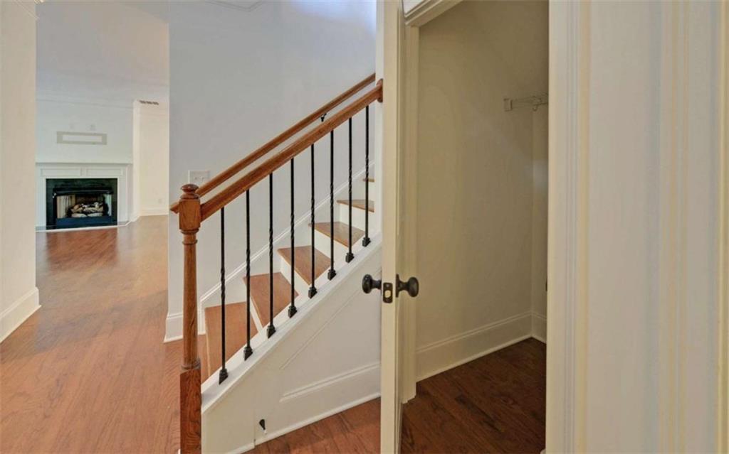 255 Abbington Way Clarkesville, GA 30523 - Photo 16 of 49 a view of a hallway with wooden floor and staircase