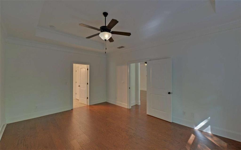 255 Abbington Way Clarkesville, GA 30523 - Photo 22 of 49 an empty room with a ceiling fan and carpet
