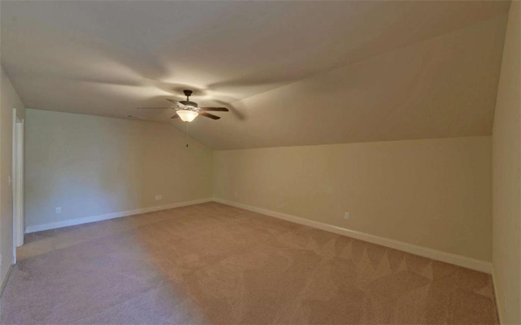 255 Abbington Way Clarkesville, GA 30523 - Photo 30 of 49 en empty room with a ceiling fan and window