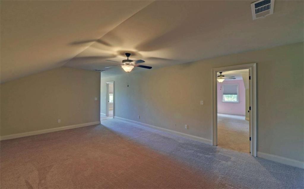 255 Abbington Way Clarkesville, GA 30523 - Photo 31 of 49 a view of an empty room with a chandelier fan