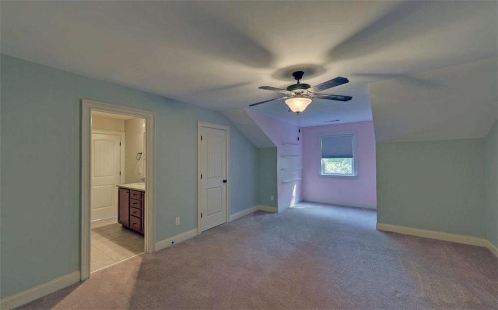 255 Abbington Way Clarkesville, GA 30523 - Photo 35 of 49 an empty room with closet and a ceiling fan