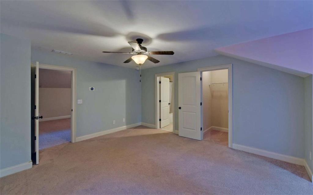 255 Abbington Way Clarkesville, GA 30523 - Photo 36 of 49 an empty room with a ceiling fan and a window