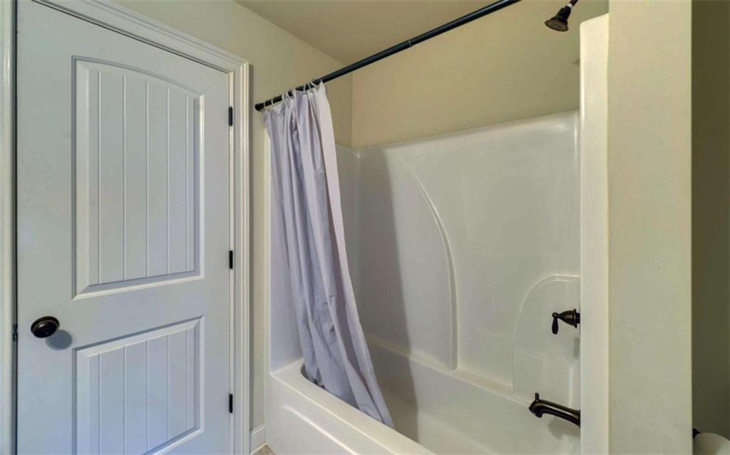255 Abbington Way Clarkesville, GA 30523 - Photo 39 of 49 a bathroom with a shower and a tub